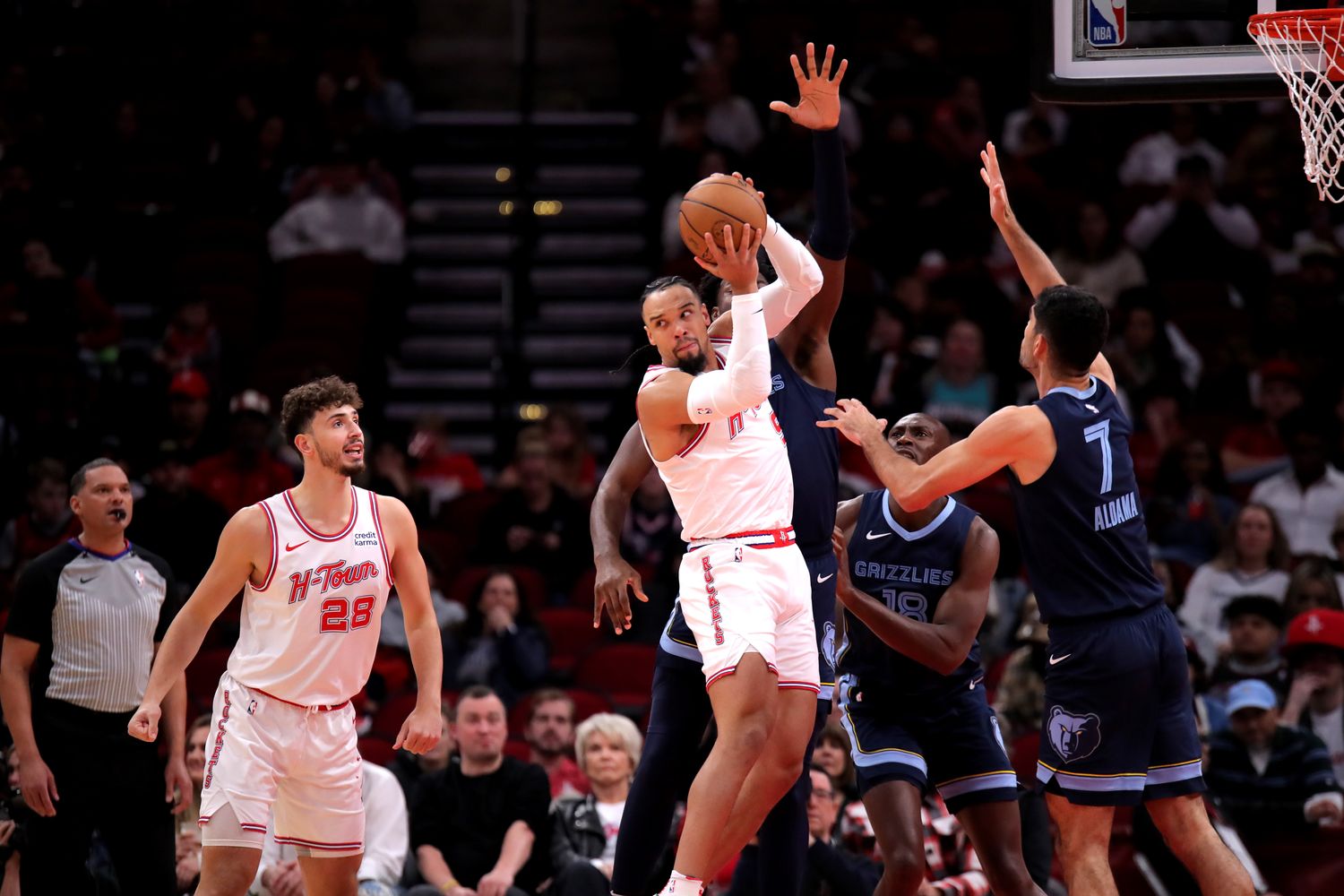 Rockets forward Dillon Brooks looks to pass to a teammate against the Memphis Grizzlies during the first quarter during the first quarter at Toyota Center.